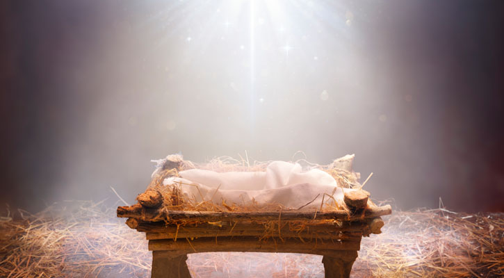 Empty manger with light shining from above