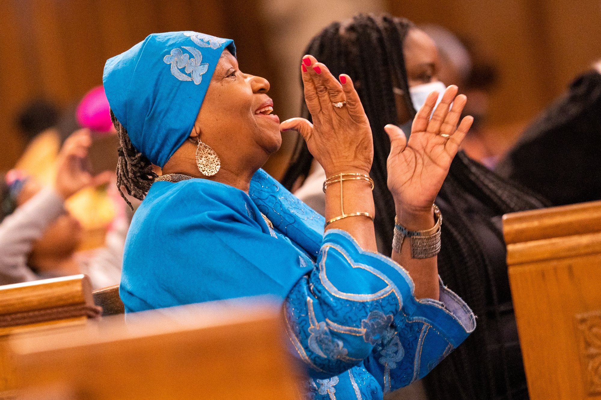 A woman claps during the Feb. 5, 2023, Mass for Black History Month at Holy Comforter-St. Cyprian Church in Washington. During the Mass, Cardinal Wilton D. Gregory called on Black Catholics and all people of color to "vastly improve our world with an understanding of the strength of character that resides within the souls of our people." (OSV News photo/Mihoko Owada, Catholic Standard)