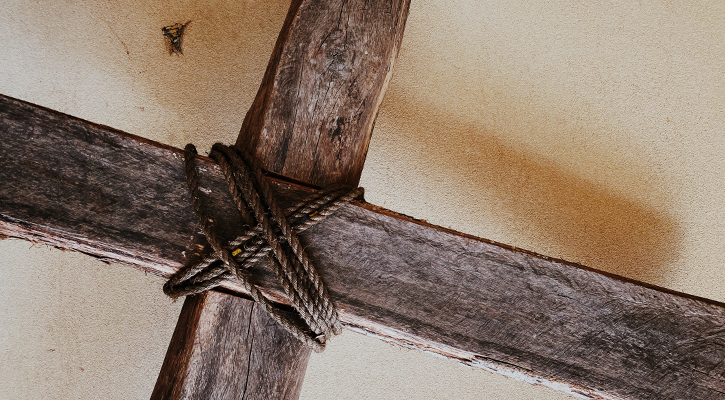 Wooden cross with rope