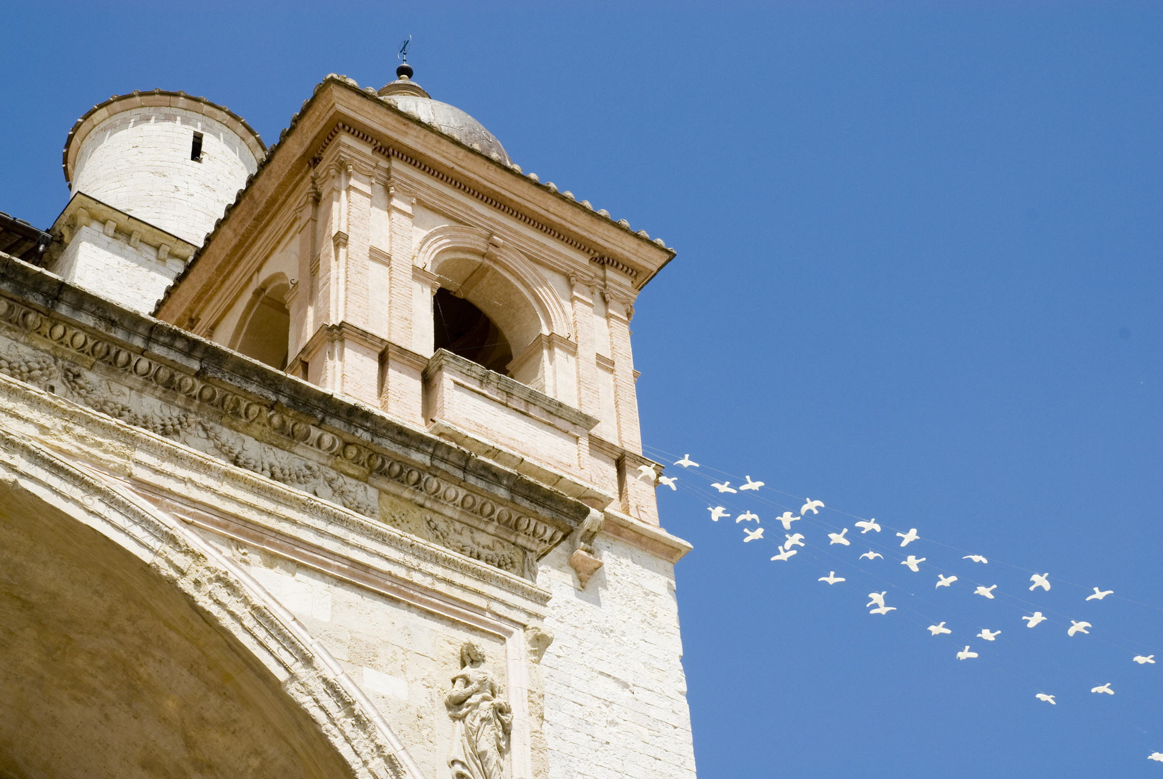 doves flying out of the basilica