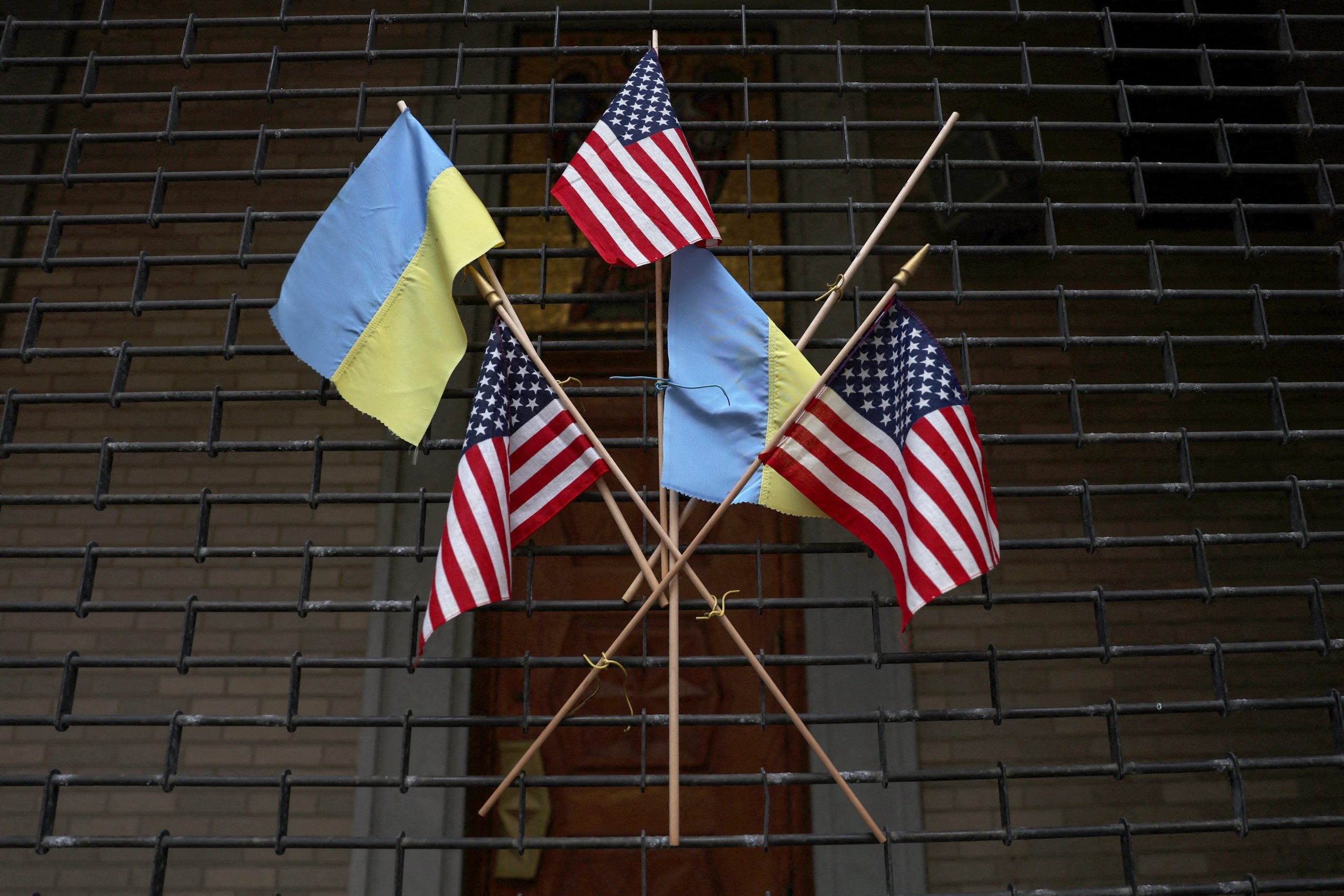 The flags of the United States and Ukraine hang on the fence of St. George Ukrainian Catholic Church in New York City March 6, 2023. (OSV News photo/Shannon Stapleton, Reuters)